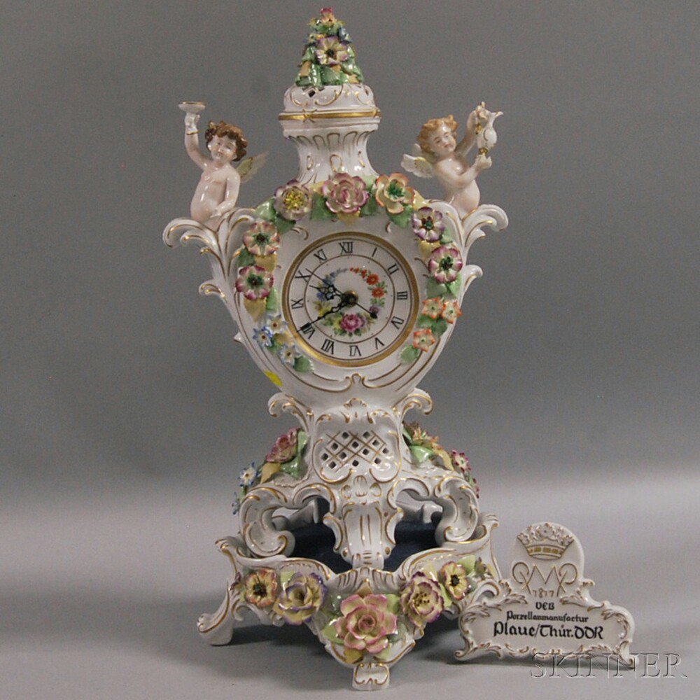 Appraisal: German Ceramic Mantel Clock th century the dial with enameled