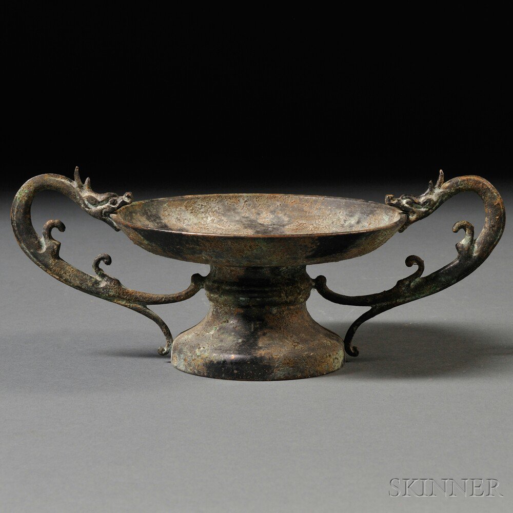 Appraisal: Footed Bronze Candle Holder China the circular drip pan flanked