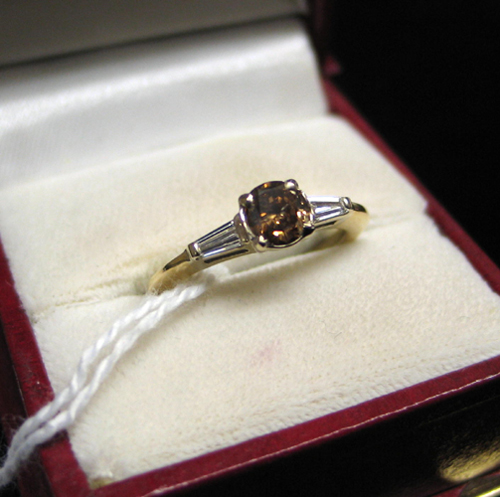 Appraisal: CHAMPAGNE DIAMOND AND FOURTEEN KARAT GOLD centered and prong set