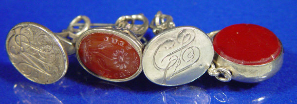 Appraisal: Three ornate silver metal seals one with a carved hardstone