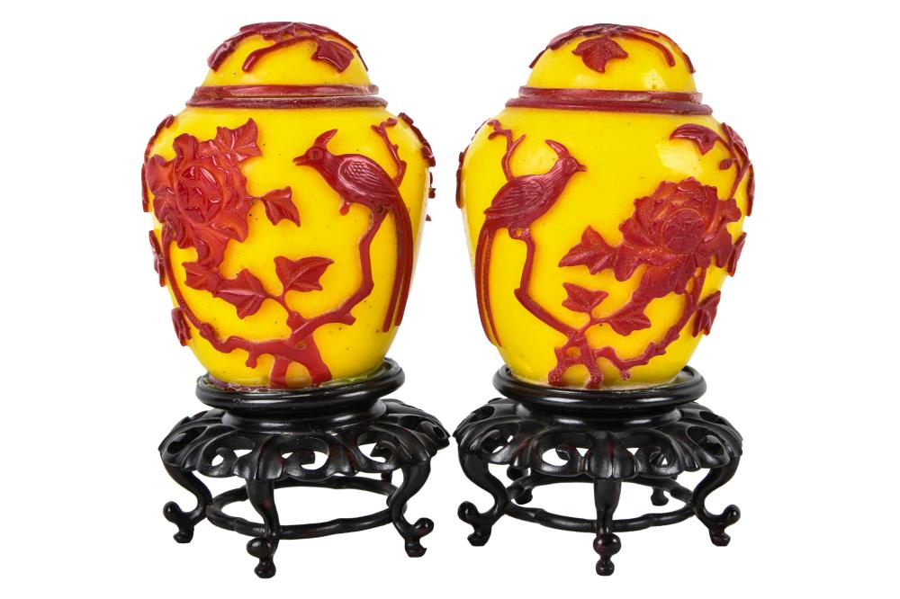 Appraisal: PAIR OF RED YELLOW PEKING GLASS COVERED JARSwith wood bases