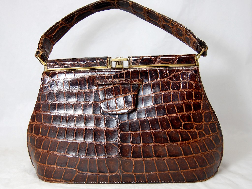 Appraisal: A brown crocodile skin vintage handbag