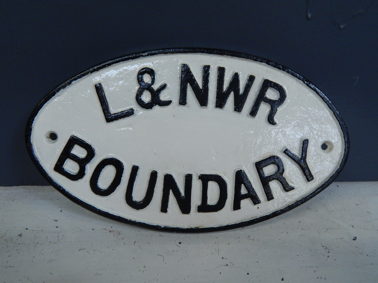 Appraisal: A cast iron London and North Western Railway Boundary plaque