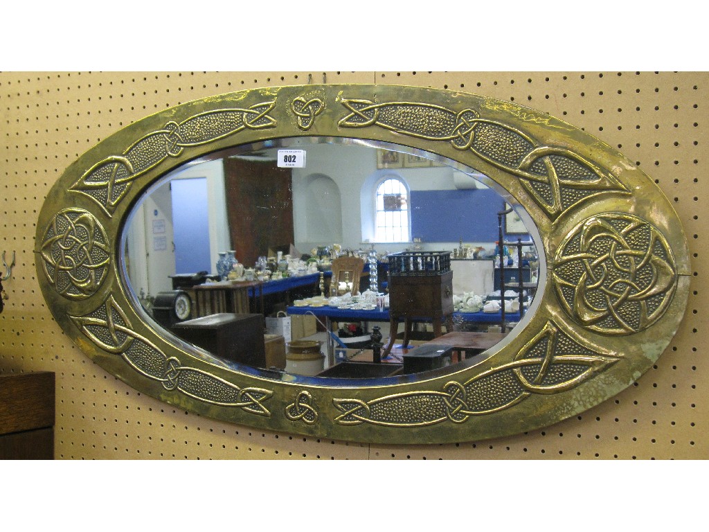 Appraisal: Embossed brass framed mirror with Celtic knotwork decoration