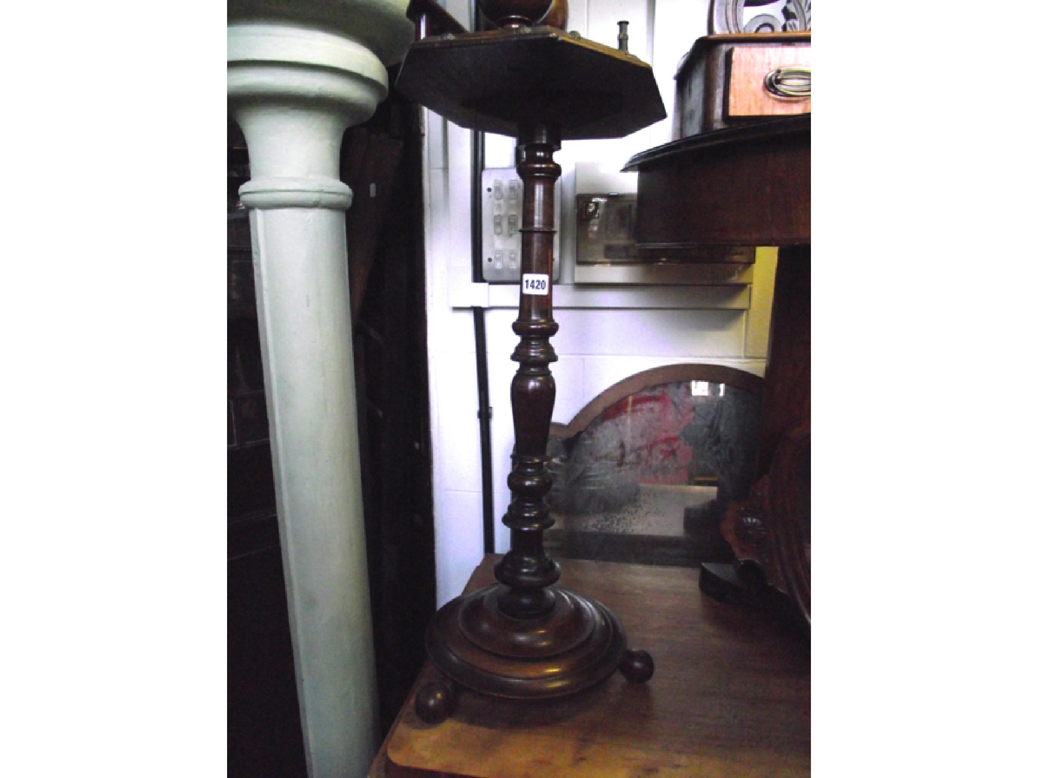 Appraisal: An Edwardian smokers companion stand on turned column supporting an