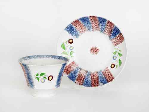 Appraisal: Red and blue rainbow spatter cup and saucer th c