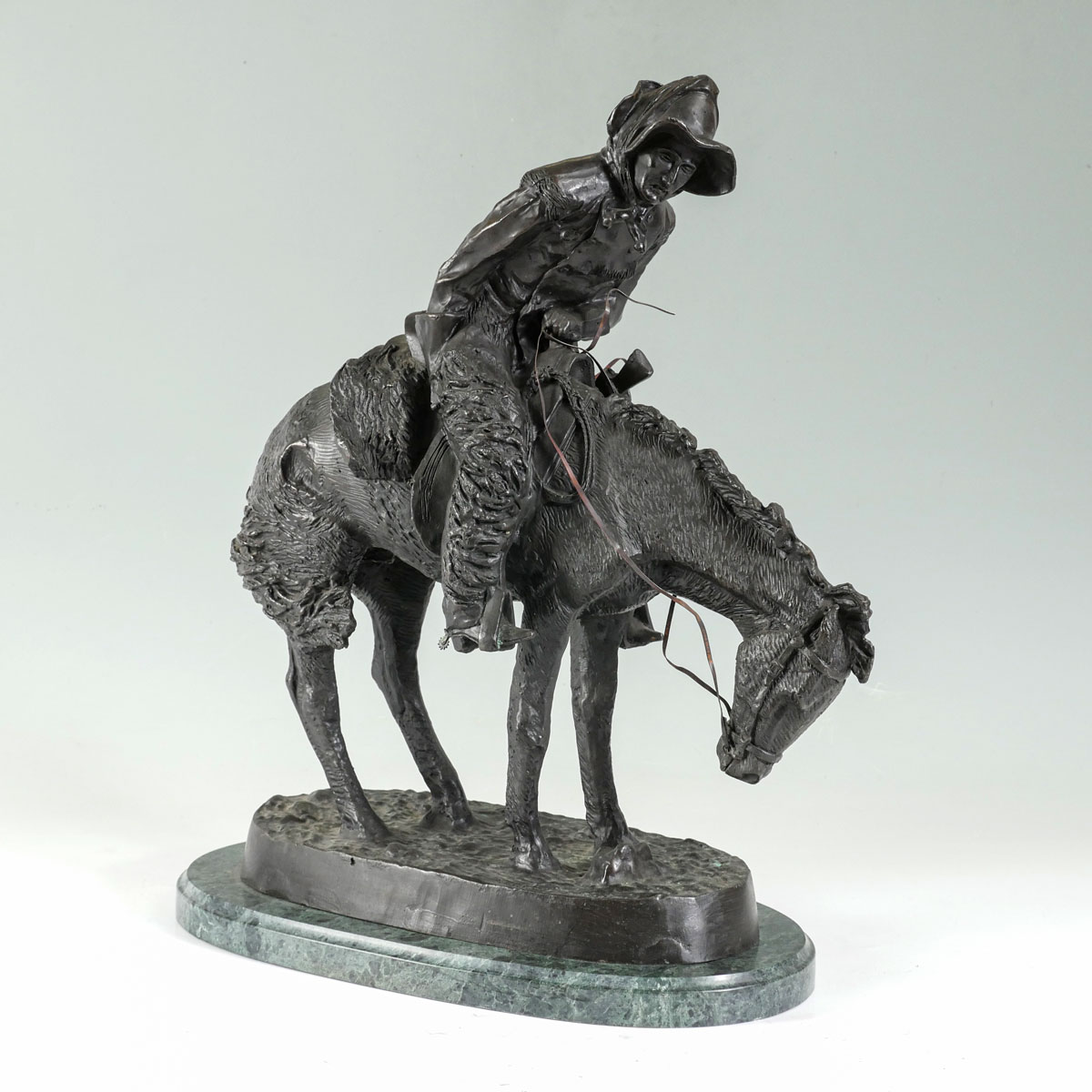 Appraisal: BRONZE COWBOY ON HORSEBACK AFTER REMINGTON '' high with beveled