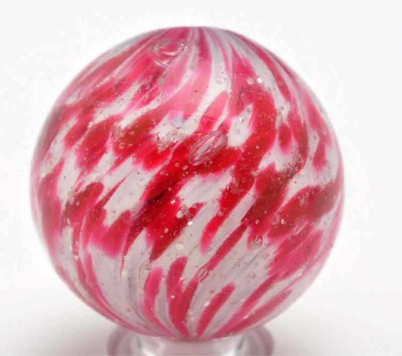 Appraisal: Onionskin Marble with Mica Description White base onionskin with red