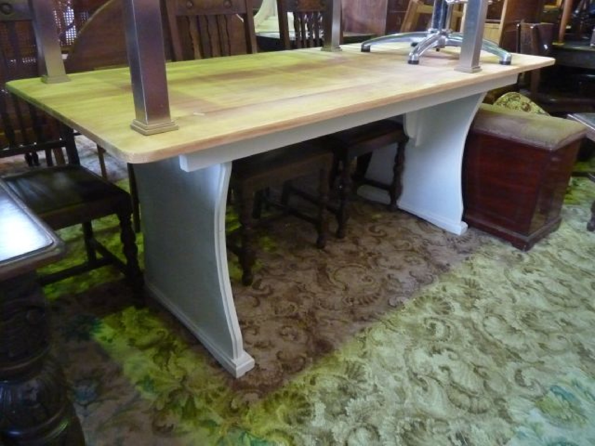 Appraisal: A kitchen dining table with scrubbed pine top raised on