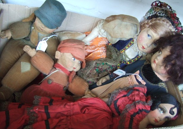 Appraisal: Two dolls with painted felt faces and overstuffed limbs modelled