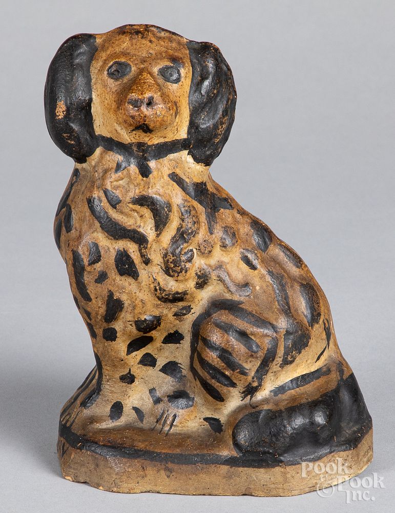 Appraisal: Painted earthenware seated spaniel th c Painted earthenware seated spaniel