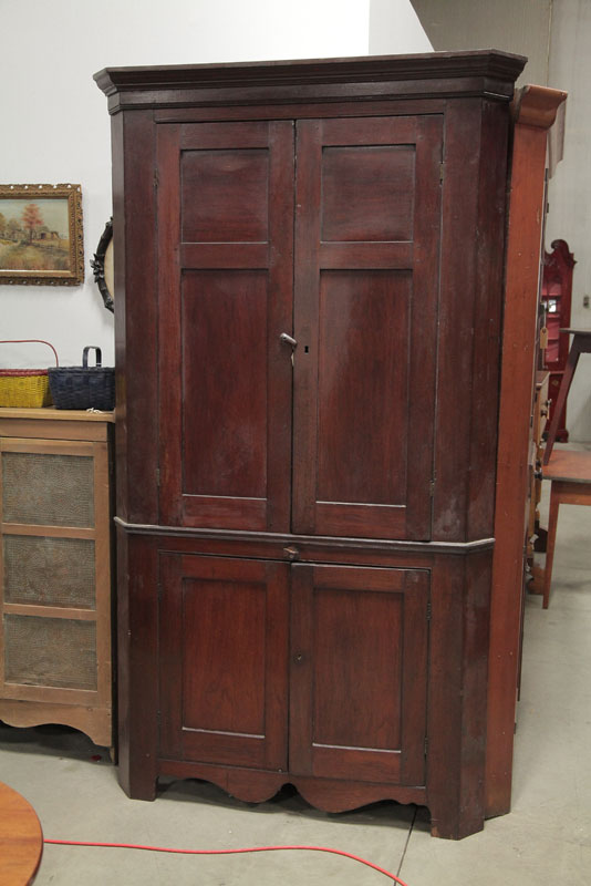 Appraisal: ONE PIECE CORNER CUPBOARD Walnut dark stained mortise and pegged