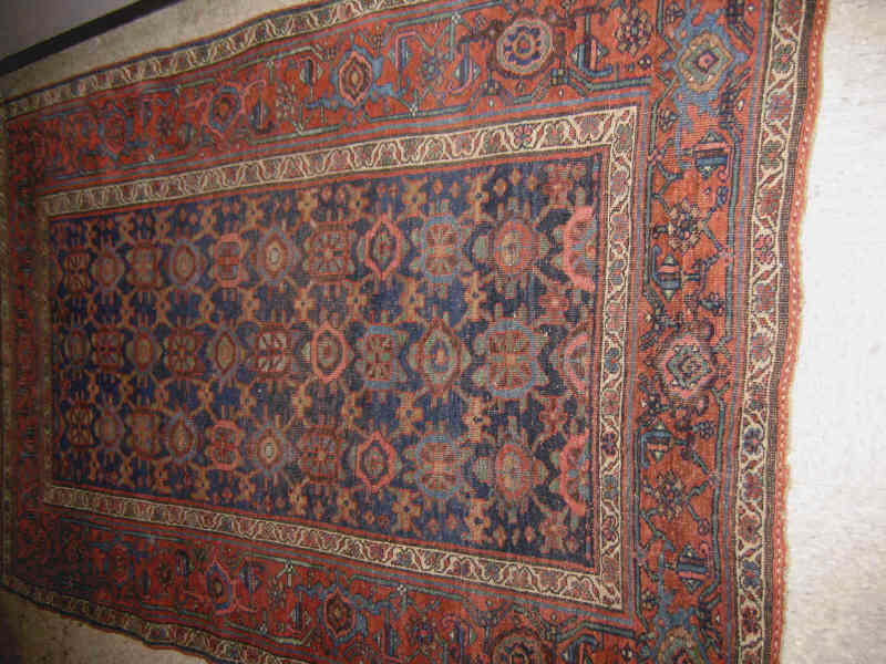 Appraisal: BIJAR THROW RUG The indigo field of allover angular geometric