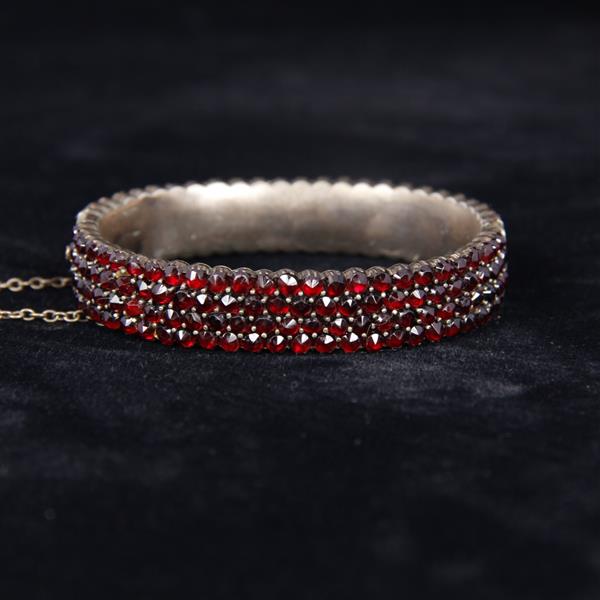 Appraisal: Victorian row Garnets on Silver Hinged Bangle Bracelet Approx -