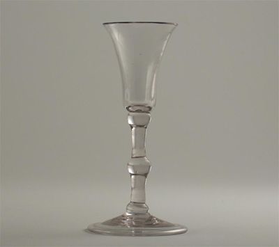 Appraisal: A small wine glass with a flared bowl on a