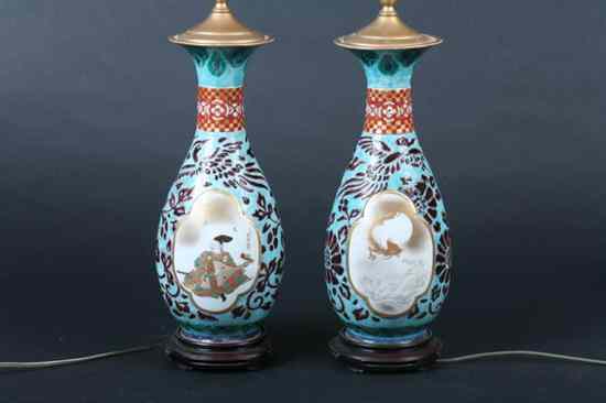 Appraisal: PAIR JAPANESE POLYCHROME PORCELAIN VASES Figural and floral decoration electrified