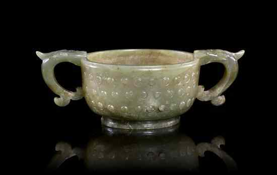 Appraisal: A Spinach Jade Libation Cup of circular form having raised