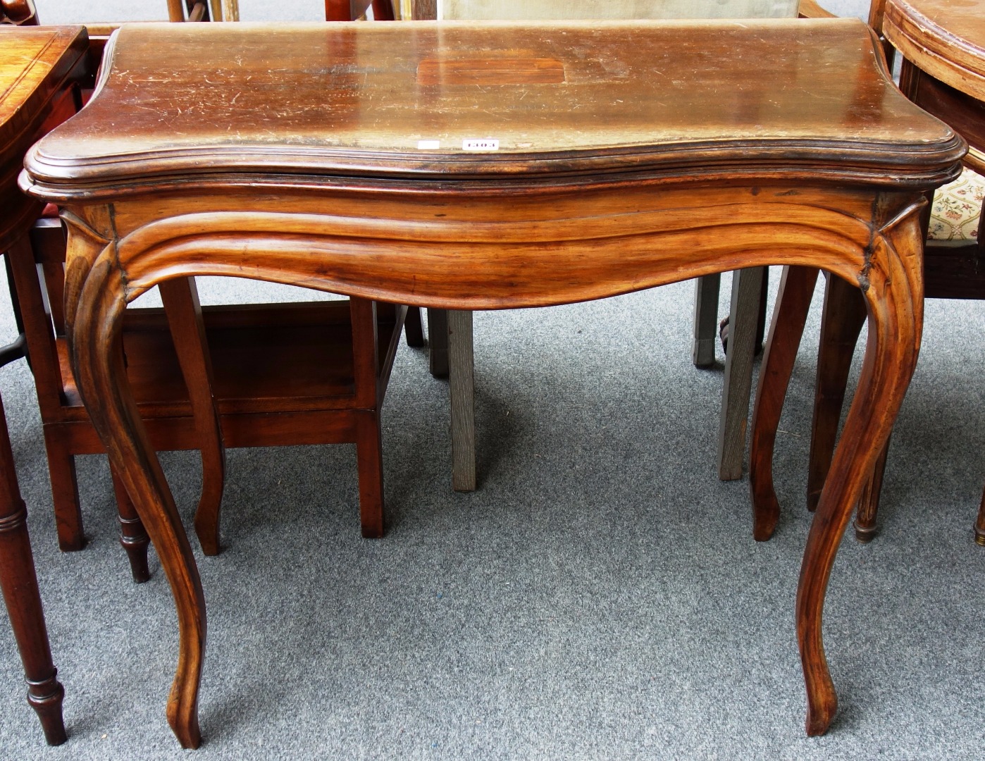 Appraisal: A th century French rosewood card table the serpentine top