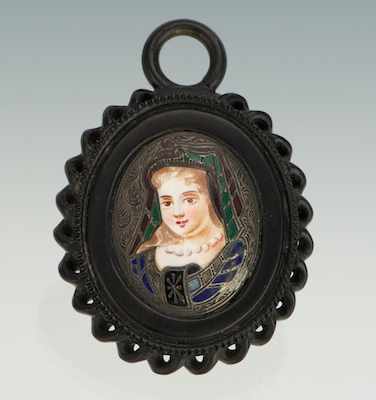 Appraisal: An Unusual Gutta Percha and Enamel Pendant Carved gutta percha