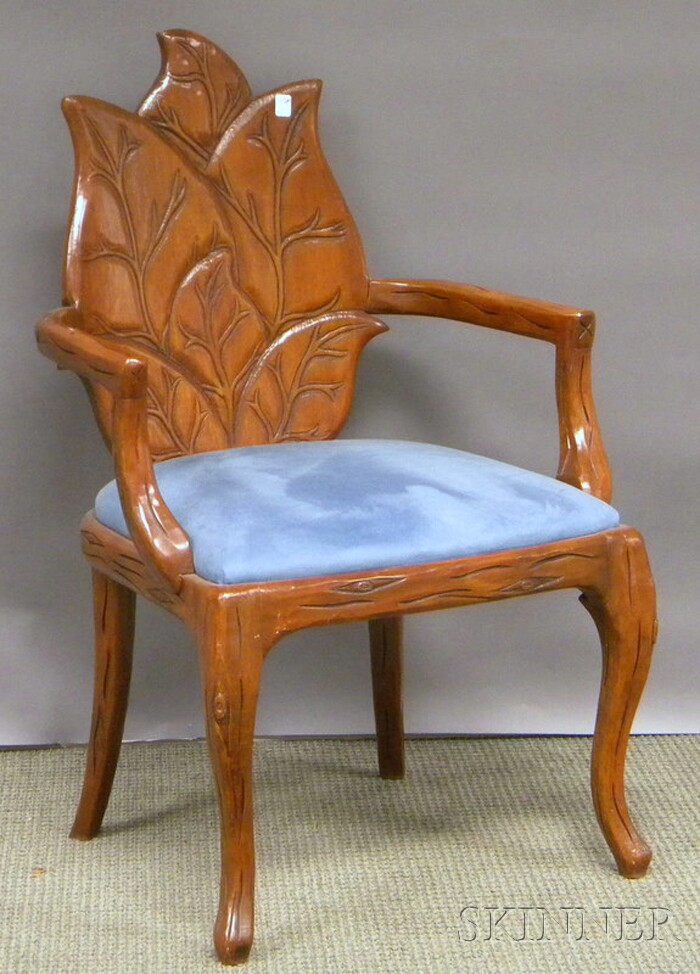 Appraisal: Naturalistic Carved Hardwood Armchair with blue upholstered seat