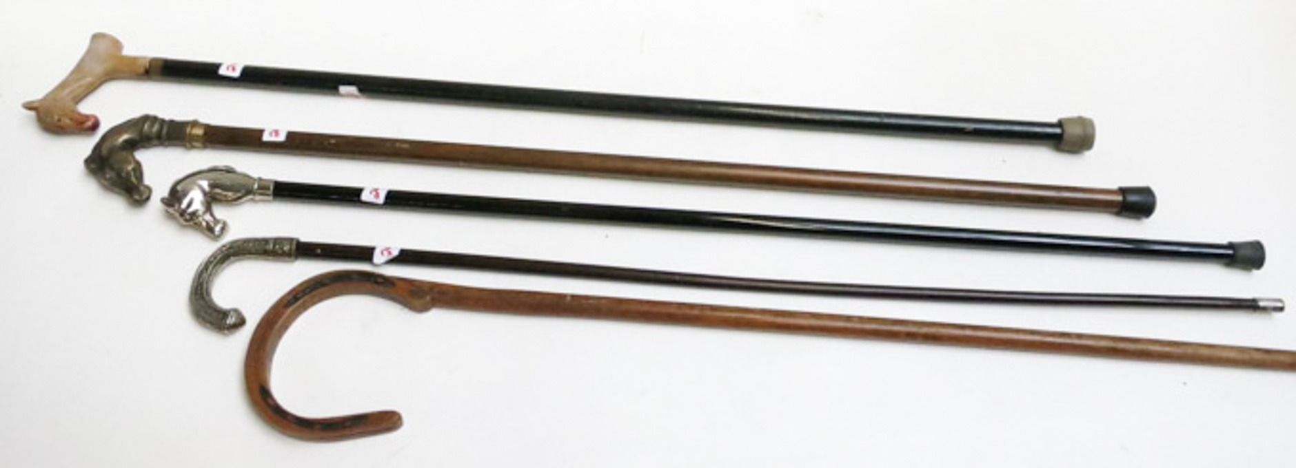 Appraisal: COLLECTION OF FIVE WALKING STICKS many of equestrian themes and