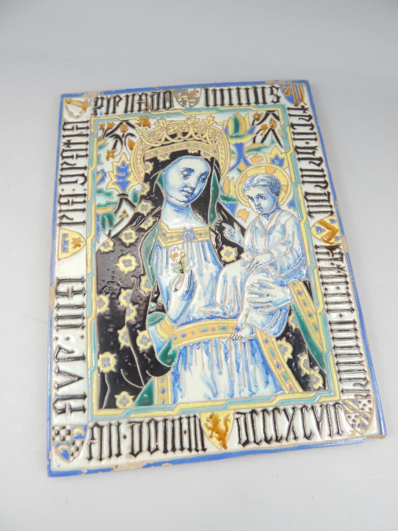 Appraisal: A terracotta style Maiolica icon on a rectangular outline set