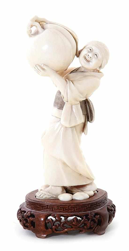 Appraisal: Japanese carved ivory okimono Meiji period elderly woman holding massive