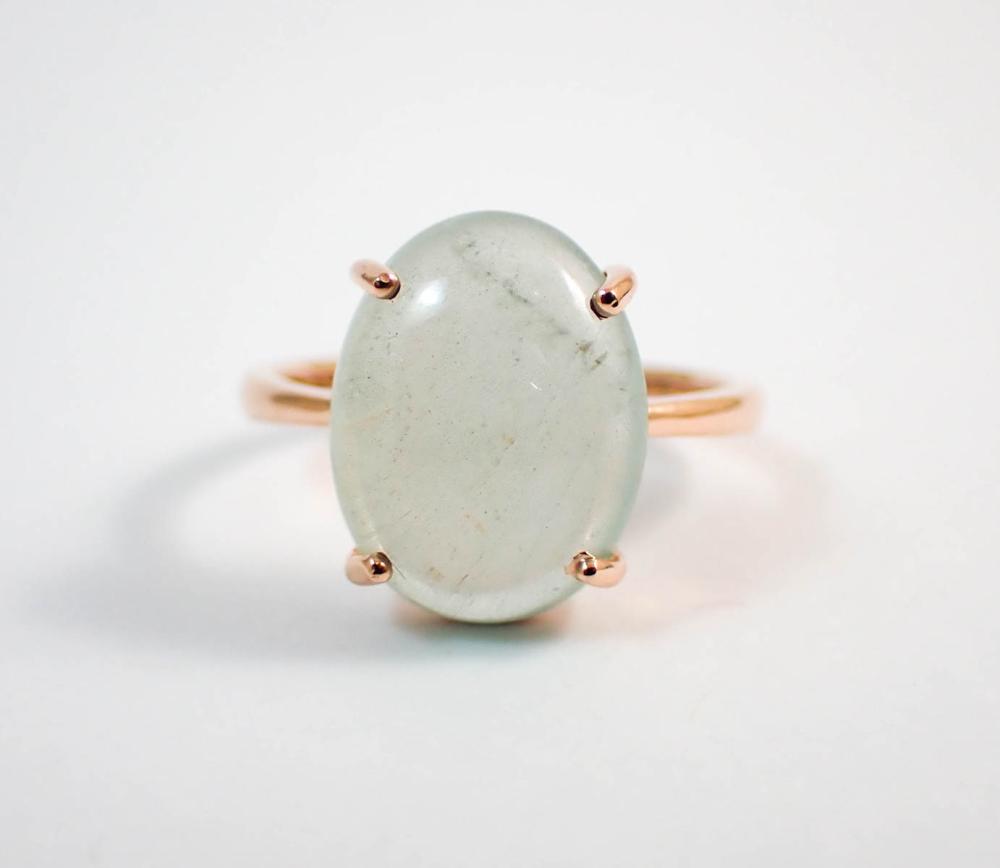 Appraisal: AQUAMARINE AND FOURTEEN KARAT ROSE GOLD RING set with a