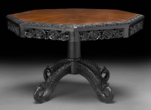 Appraisal: A Ceylonese style ebonized and walnut center table The octagonal