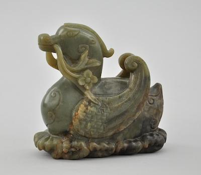 Appraisal: A Chinese Archaistic Style Jade Carving Green jade carving in