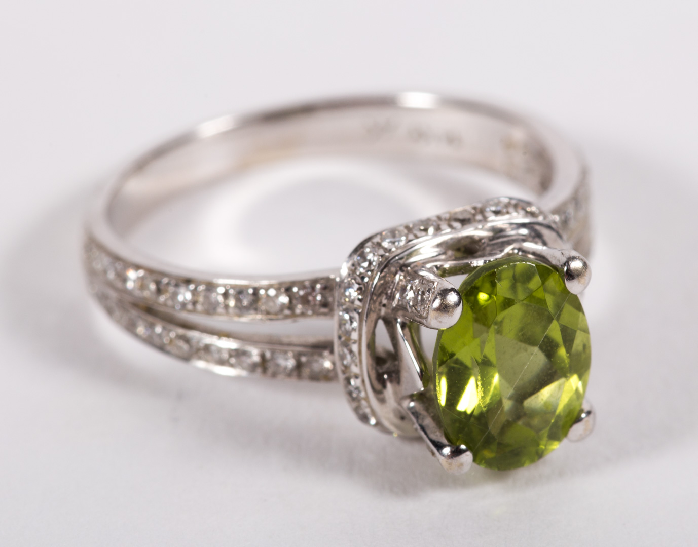 Appraisal: A Peridot and Pave Diamond Ring mounted in K white