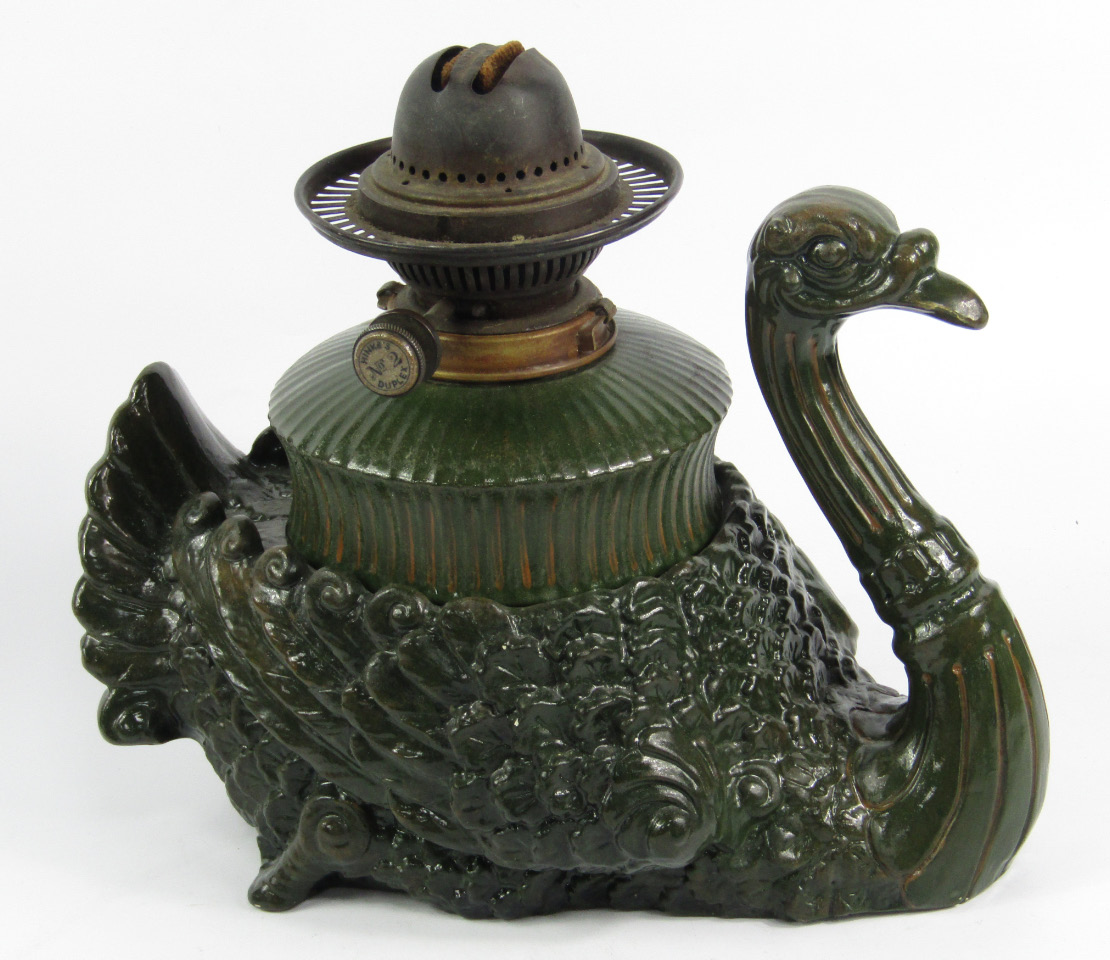 Appraisal: A Hinks No Duplex pottery oil lamp modelled as an