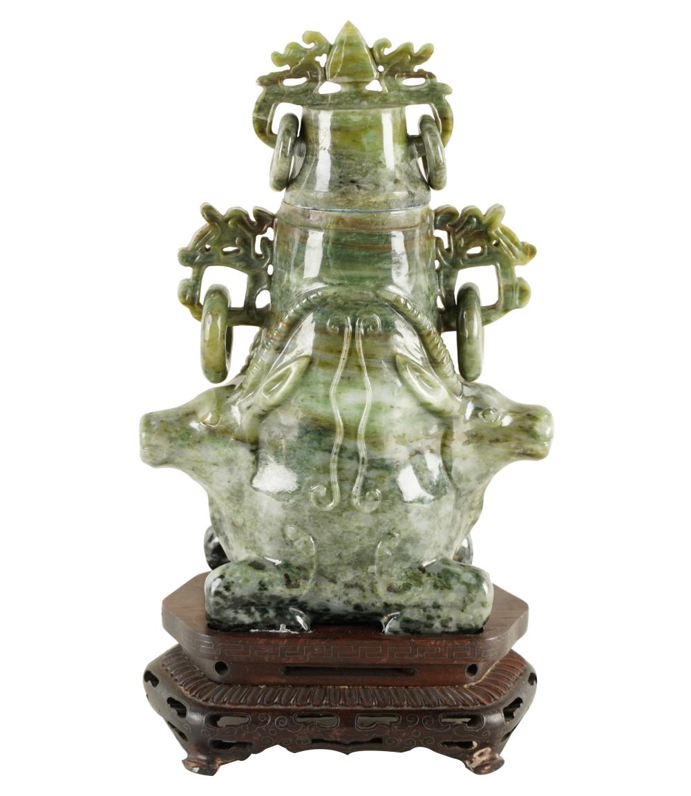 Appraisal: CHINESE CARVED GREEN STONE COVERED VASEwith a fitted wood stand