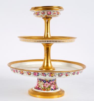 Appraisal: A French porcelain three-tier cake stand mid th Century with