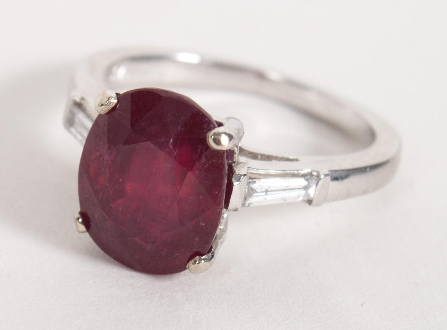 Appraisal: K white gold ruby and diamond ring center oval ruby