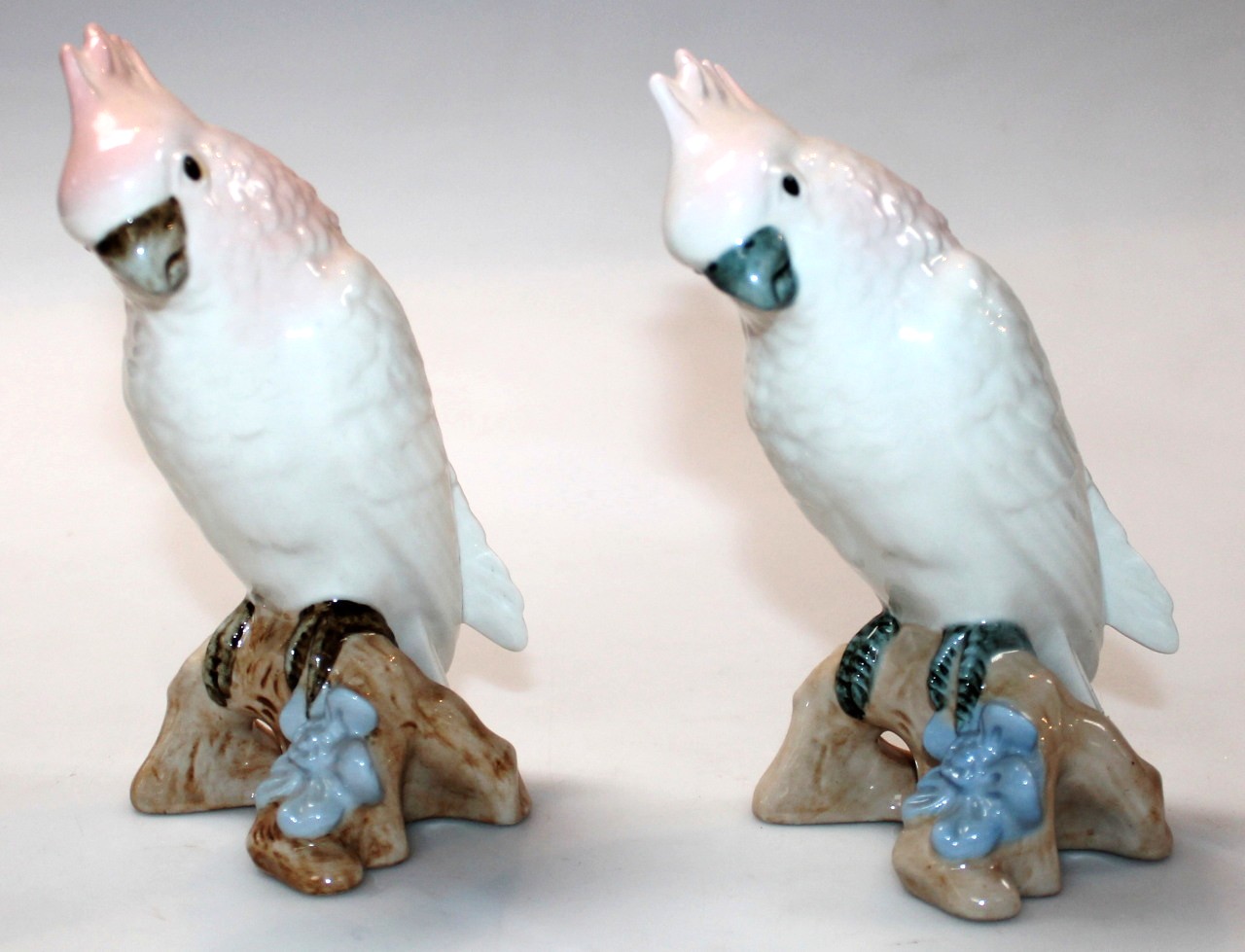 Appraisal: A pair of thC Royal Dux figures of parakeets each