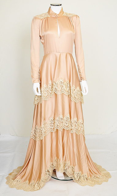 Appraisal: A vintage pale pink silk wedding dress with cream lace