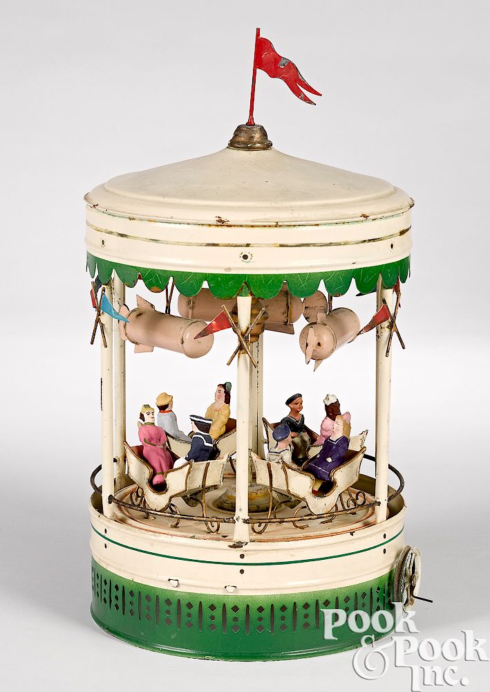 Appraisal: German painted tin carousel with dirigibles Unusual German painted tin