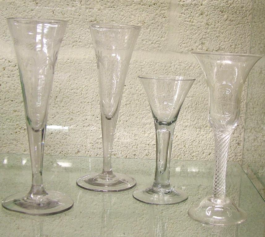 Appraisal: Pair of Antique tall wine glasses the trumpet bowls engraved