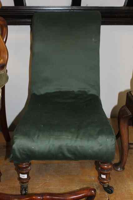 Appraisal: A LATE VICTORIAN NURSING CHAIR on turned walnut forelegs with