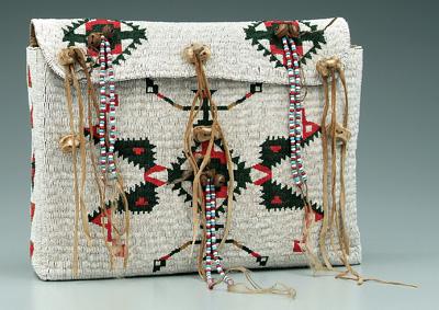 Appraisal: Beaded leather bag sinew sewn multi-colored geometric beaded decoration on