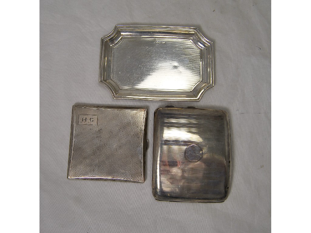 Appraisal: Two engine turned silver cigarette cases and engine turned card