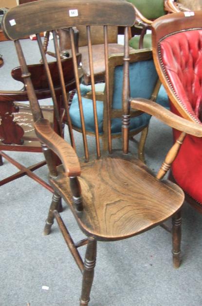 Appraisal: A Victorian oak and beech kitchen chair raised on turned