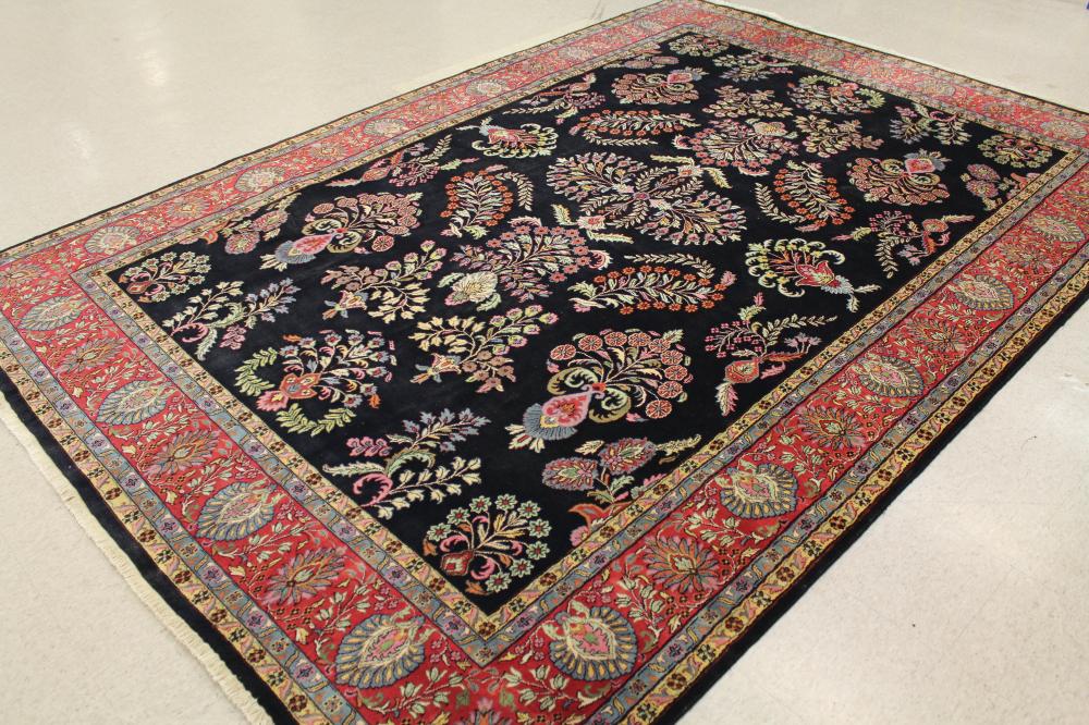 Appraisal: HAND KNOTTED ORIENTAL CARPET Indo-Persian Sarouk floral design on black