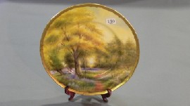 Appraisal: A Royal Worcester cabinet plate painted by Raymond Rushton of