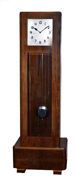 Appraisal: AN ART DECO WALNUT LONGCASE CLOCK the square silvered dial