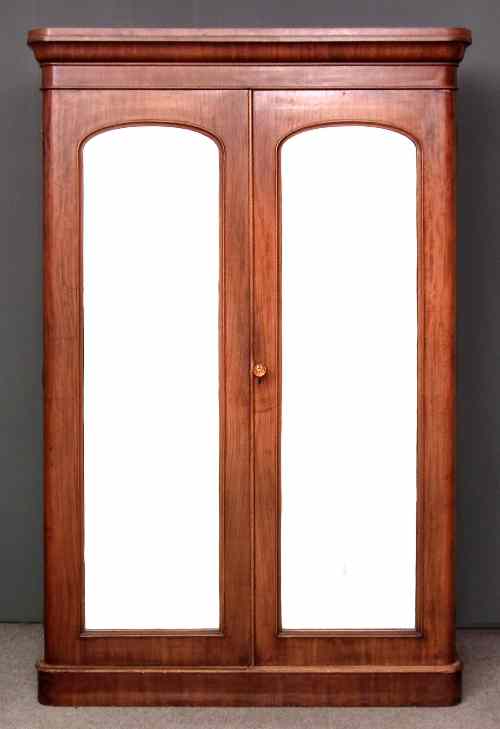 Appraisal: A Victorian mahogany wardrobe with rounded front corners the top