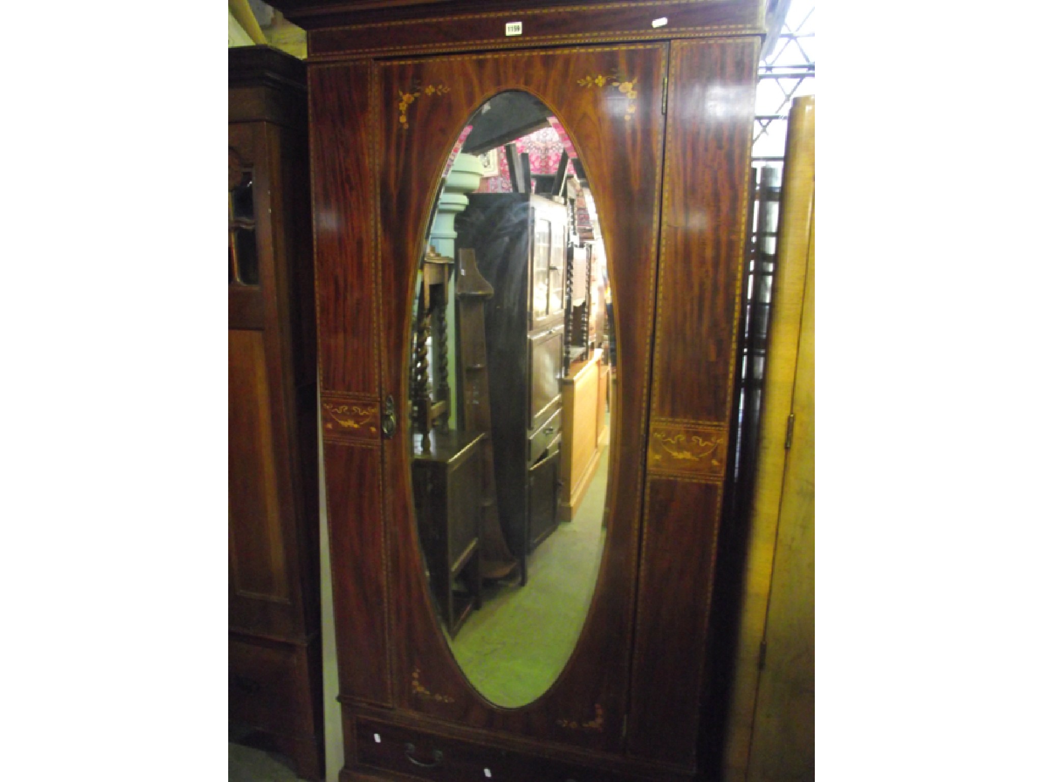 Appraisal: An inlaid Edwardian mahogany wardrobe with chequered string floral and