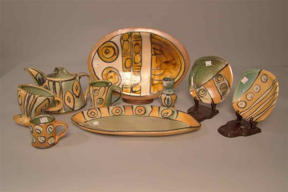 Appraisal: THREE PORTUGUESE POTTERY CHARGERS one with a basket in the