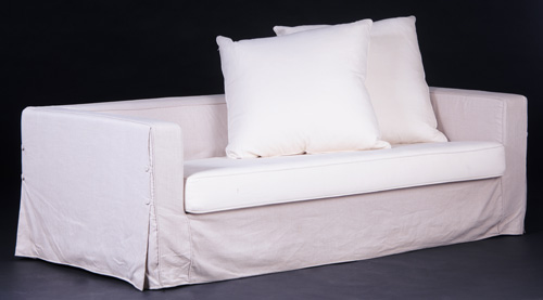 Appraisal: CHRISTIAN LIAGRE Even-arm sofa fully upholstered in white fabric the